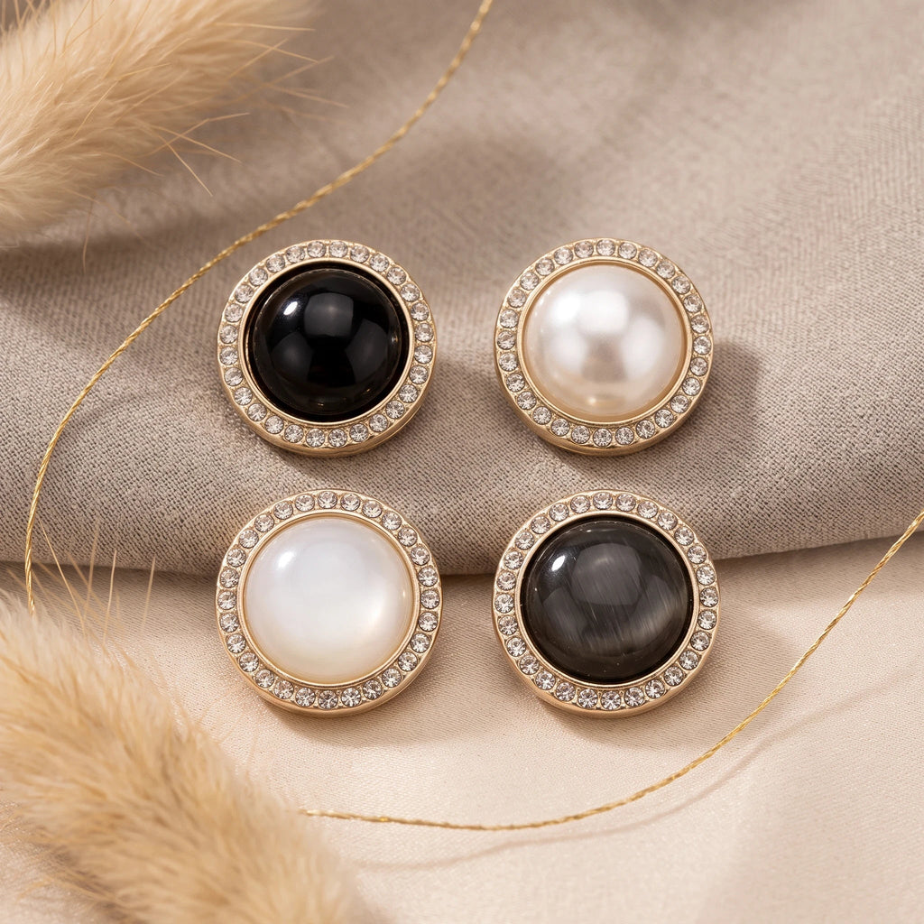 Eternal Aura Éclat hijab magnets featuring round decorative designs with crystal borders in black and white tones.