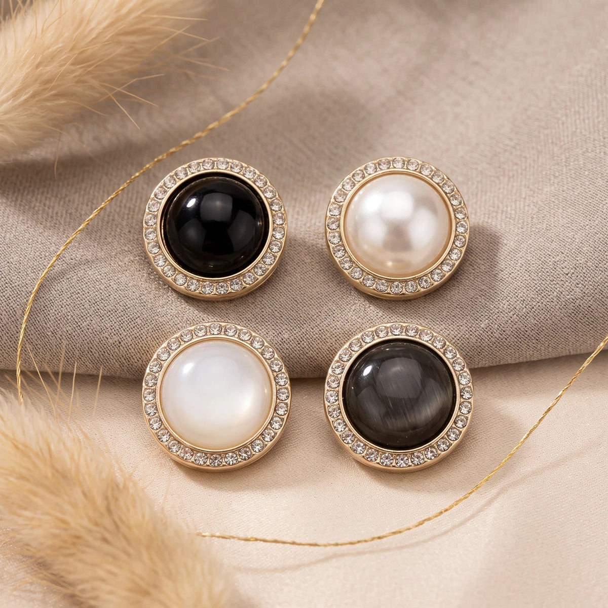 Eternal Aura Éclat hijab magnets featuring round decorative designs with crystal borders in black and white tones.